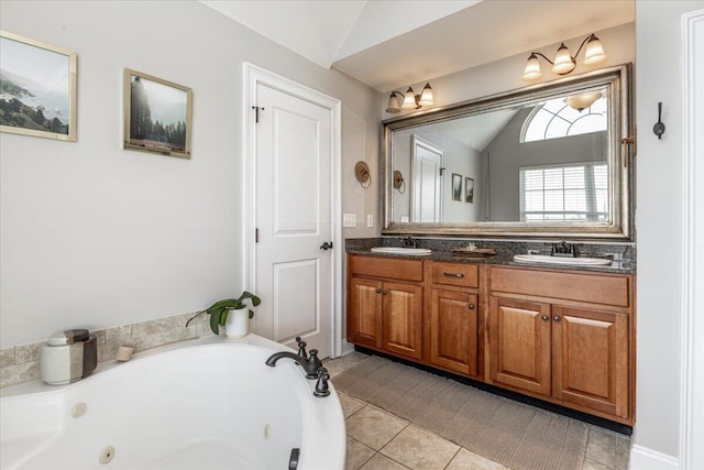 7918 Chianti Way, Chattanooga, TN 37421 - bathroom with vaulted ceiling, double vanity, a tub with jets, and tile patterned flooring