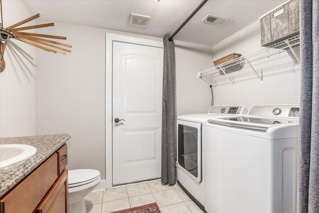 7918 Chianti Way, Chattanooga, TN 37421 - laundry room featuring washing machine and dryer and light tile patterned floors