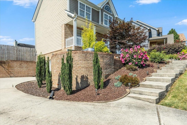 7918 Chianti Way, Chattanooga, TN 37421 - view of side of home with stairs and brick siding