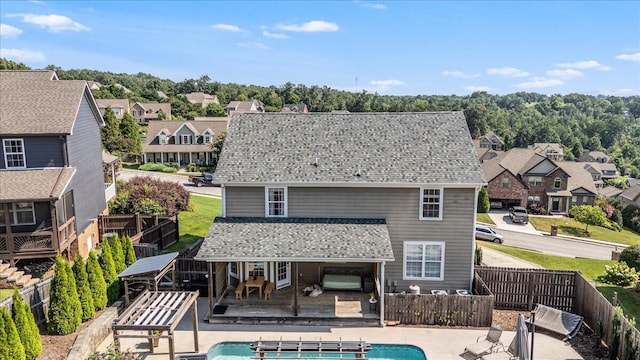 7918 Chianti Way, Chattanooga, TN 37421 - rear view of house featuring a fenced backyard, a residential view, a deck, and a patio area
