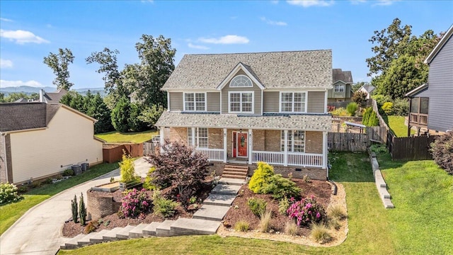 7918 Chianti Way, Chattanooga, TN 37421 - view of front facade with covered porch, brick siding, and roof with shingles