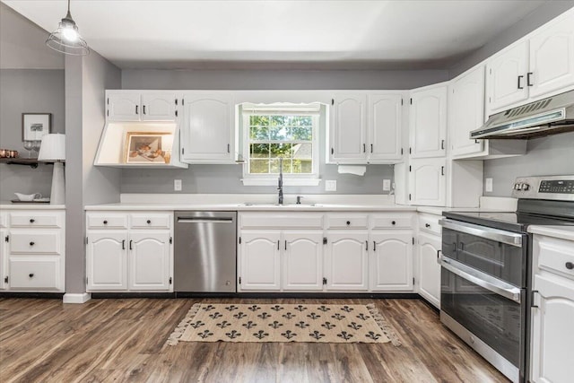 2416 Mourning Dove Ln, Signal Mountain, TN 37377 - kitchen featuring appliances with stainless steel finishes, under cabinet range hood, dark wood-style flooring, and white cabinetry