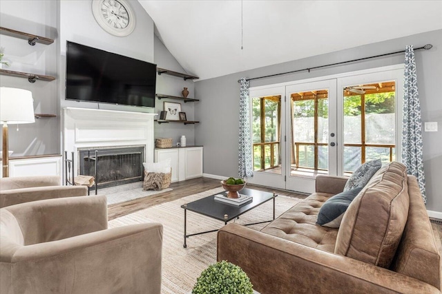 2416 Mourning Dove Ln, Signal Mountain, TN 37377 - living area featuring vaulted ceiling, wood finished floors, french doors, and a fireplace