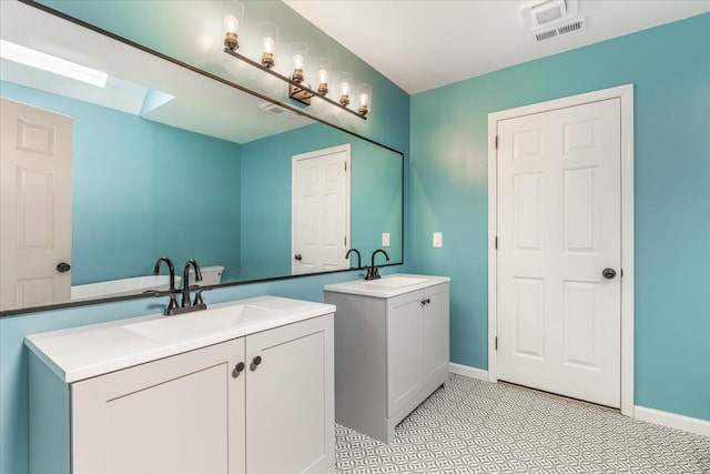 2416 Mourning Dove Ln, Signal Mountain, TN 37377 - full bath with two vanities and a skylight