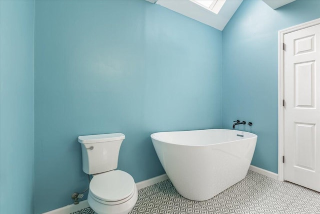 2416 Mourning Dove Ln, Signal Mountain, TN 37377 - full bathroom with a soaking tub, a skylight, vaulted ceiling, and tile patterned floors