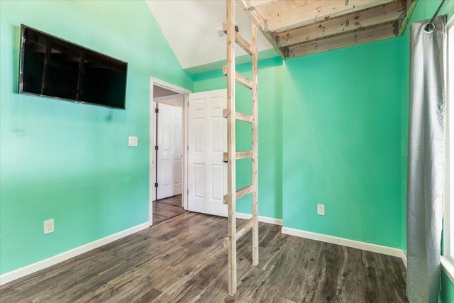 2416 Mourning Dove Ln, Signal Mountain, TN 37377 - unfurnished bedroom featuring wood finished floors and lofted ceiling