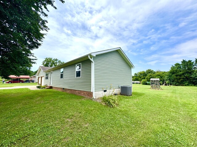 1828 Saunders Rd, Ringgold, GA 30736 - view of property exterior featuring crawl space, a lawn, and a playground