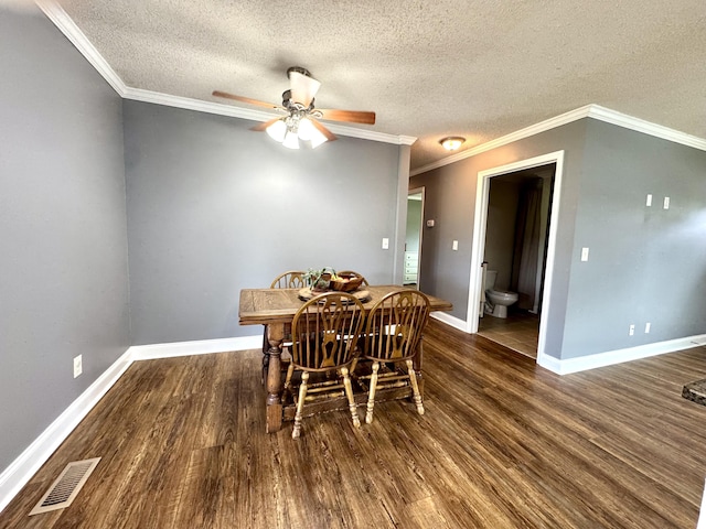 1828 Saunders Rd, Ringgold, GA 30736 - dining area with wood finished floors, a ceiling fan, a textured ceiling, and ornamental molding