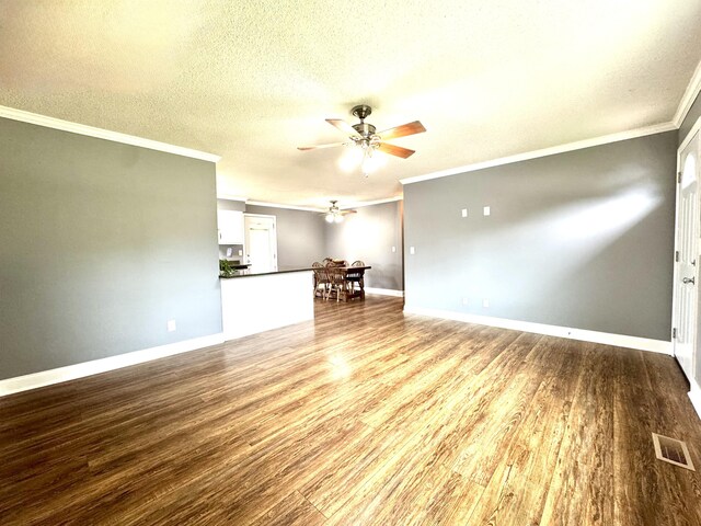 1828 Saunders Rd, Ringgold, GA 30736 - unfurnished living room with a ceiling fan, ornamental molding, wood finished floors, and a textured ceiling