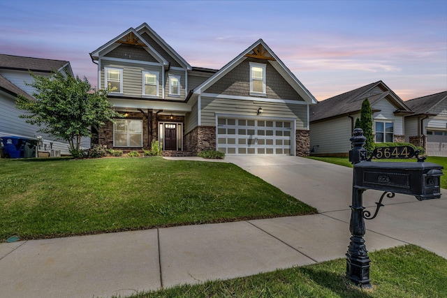 5644 Bungalow Cir, Hixson, TN 37343 - craftsman inspired home featuring stone siding, concrete driveway, a front lawn, and an attached garage