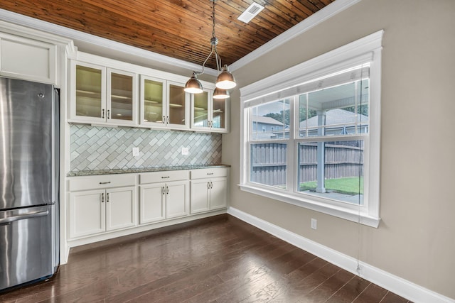 5644 Bungalow Cir, Hixson, TN 37343 - kitchen with freestanding refrigerator, crown molding, decorative backsplash, glass insert cabinets, and pendant lighting