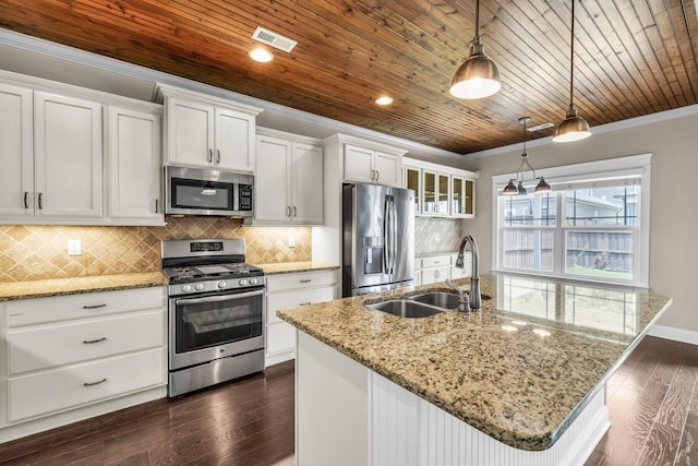 5644 Bungalow Cir, Hixson, TN 37343 - kitchen with appliances with stainless steel finishes, dark wood-type flooring, wood ceiling, white cabinets, and a kitchen island with sink