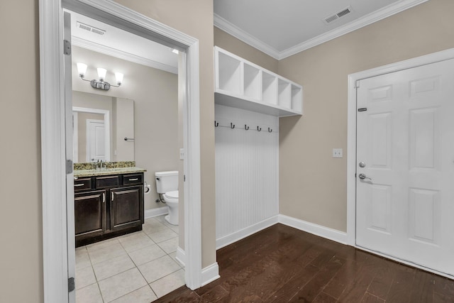 5644 Bungalow Cir, Hixson, TN 37343 - mudroom featuring crown molding and light wood finished floors