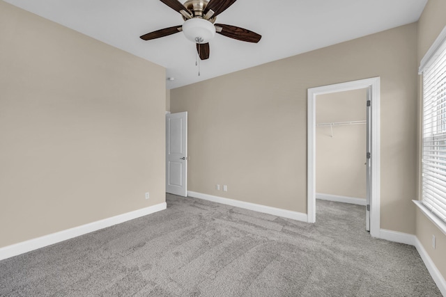 5644 Bungalow Cir, Hixson, TN 37343 - unfurnished bedroom featuring light carpet, a walk in closet, a closet, and a ceiling fan