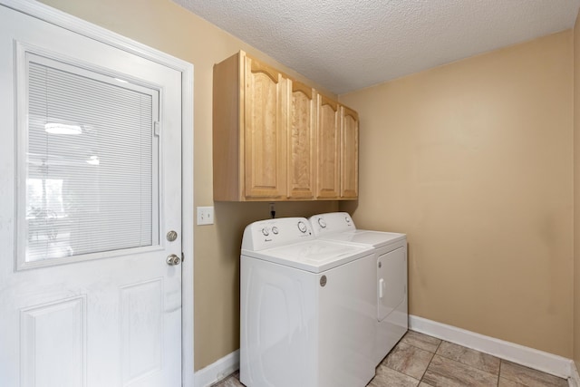 6509 Mill Stream Dr, Harrison, TN 37341 - laundry room featuring washing machine and dryer, cabinet space, and a textured ceiling