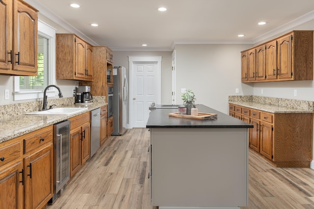 305 River Pointe Cir NE, Charleston, TN 37310 - kitchen with wine cooler, a center island, ornamental molding, appliances with stainless steel finishes, and brown cabinets