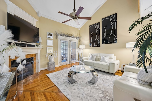 2507 Saint Lucie Ct, Chattanooga, TN 37421 - living area featuring ornamental molding, vaulted ceiling, a fireplace, ceiling fan, and wood finished floors