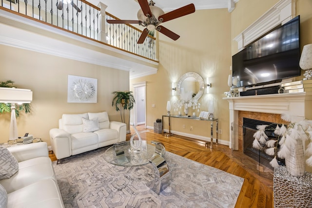 2507 Saint Lucie Ct, Chattanooga, TN 37421 - living room featuring a high ceiling, a ceiling fan, wood finished floors, ornamental molding, and a fireplace