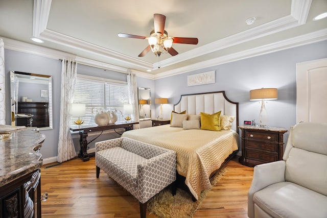 2507 Saint Lucie Ct, Chattanooga, TN 37421 - bedroom with a tray ceiling, ornamental molding, light wood-style flooring, and a ceiling fan