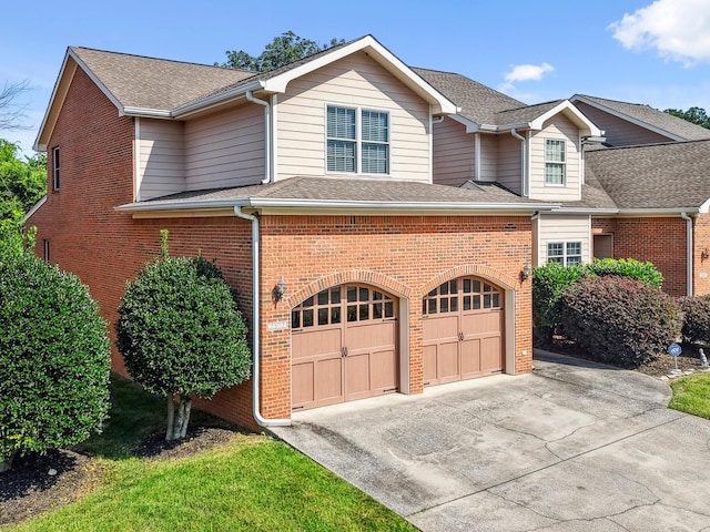2507 Saint Lucie Ct, Chattanooga, TN 37421 - traditional home with brick siding, driveway, roof with shingles, and a garage