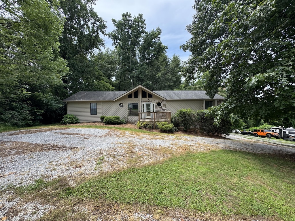 7162 Lea Rd, Chattanooga, TN 37421 - view of front of house with a front lawn and a wooden deck