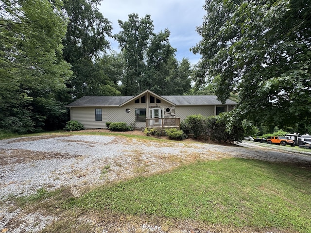 7162 Lea Rd, Chattanooga, TN 37421 - view of front of house with a front lawn and a wooden deck