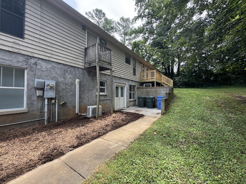 7162 Lea Rd, Chattanooga, TN 37421 - rear view of house with a yard and a balcony
