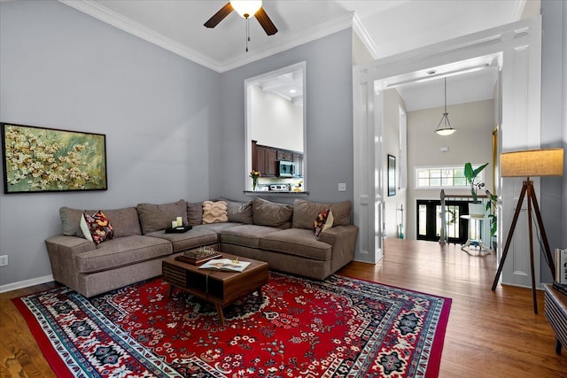 9129 Wood Dale Ln, Hixson, TN 37343 - living room with wood finished floors, ceiling fan, crown molding, and a towering ceiling