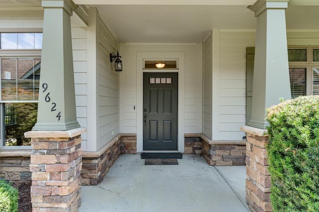 9624 Collier Pl, Ooltewah, TN 37363 - view of exterior entry featuring covered porch and stone siding