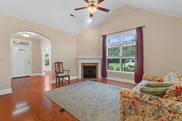 9624 Collier Pl, Ooltewah, TN 37363 - living area with arched walkways, healthy amount of natural light, a ceiling fan, wood finished floors, and high vaulted ceiling