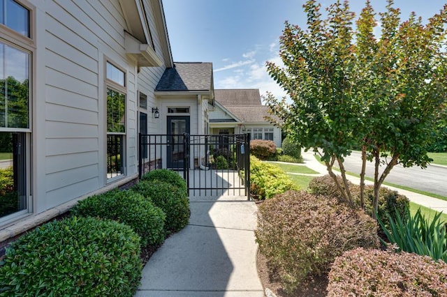 9624 Collier Pl, Ooltewah, TN 37363 - doorway to property featuring a shingled roof and a gate