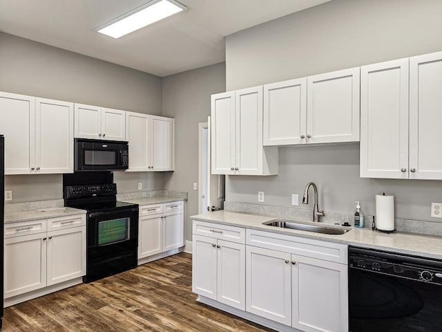 9624 Collier Pl, Ooltewah, TN 37363 - kitchen with black appliances, white cabinets, and light countertops