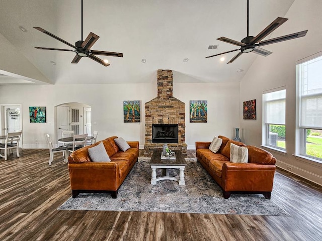 9624 Collier Pl, Ooltewah, TN 37363 - living area featuring a ceiling fan, high vaulted ceiling, wood finished floors, arched walkways, and recessed lighting