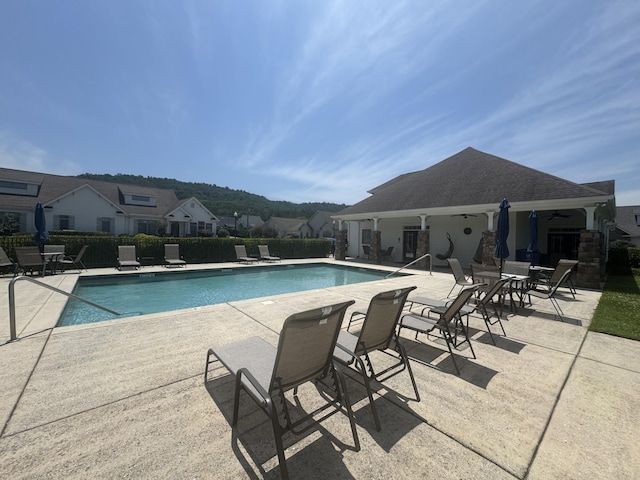 9624 Collier Pl, Ooltewah, TN 37363 - community pool with a patio area, ceiling fan, and a residential view