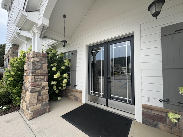 9624 Collier Pl, Ooltewah, TN 37363 - view of exterior entry featuring french doors and stone siding