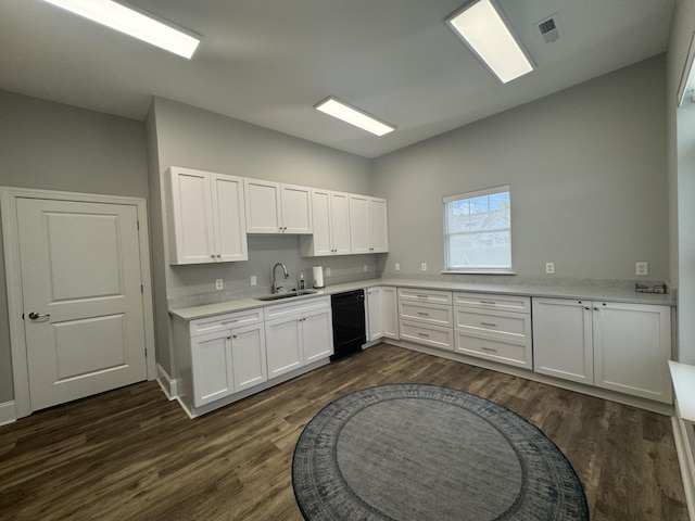9624 Collier Pl, Ooltewah, TN 37363 - kitchen featuring dishwasher, white cabinets, light countertops, dark wood-style floors, and vaulted ceiling