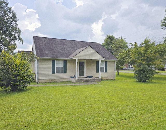 407 W 3rd St, Jasper, TN 37347 - view of front of house featuring a front yard and a shingled roof