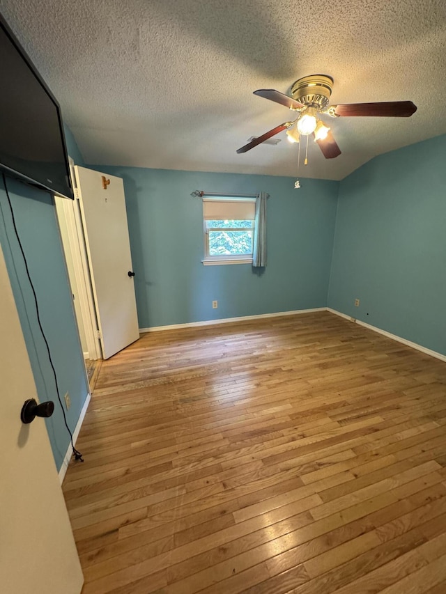 311 Branch Dr, Hixson, TN 37343 - unfurnished bedroom featuring a textured ceiling, wood-type flooring, and a ceiling fan