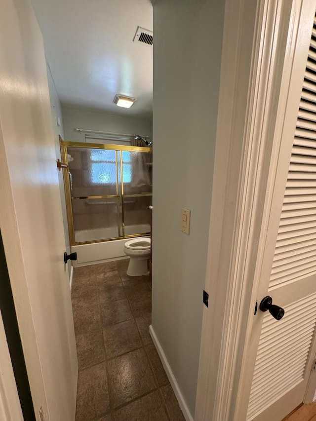311 Branch Dr, Hixson, TN 37343 - bathroom with toilet and shower / bath combination with glass door