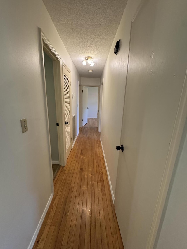 311 Branch Dr, Hixson, TN 37343 - hall featuring wood-type flooring and a textured ceiling