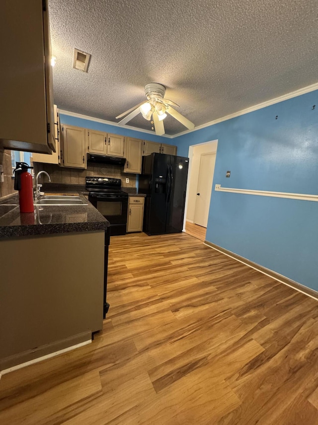 311 Branch Dr, Hixson, TN 37343 - kitchen featuring black appliances, under cabinet range hood, ceiling fan, light wood-style floors, and a textured ceiling