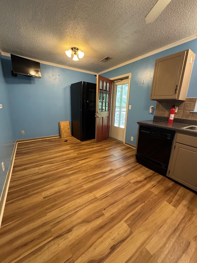 311 Branch Dr, Hixson, TN 37343 - kitchen featuring black dishwasher, crown molding, dark countertops, light wood finished floors, and a textured ceiling