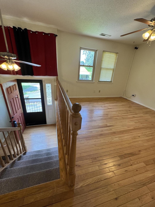311 Branch Dr, Hixson, TN 37343 - foyer entrance with a ceiling fan, light wood-style floors, a textured ceiling, and stairway
