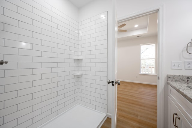 3016 Addison Rd, Chattanooga, TN 37406 - full bath featuring vanity, wood finished floors, ceiling fan, and tiled shower