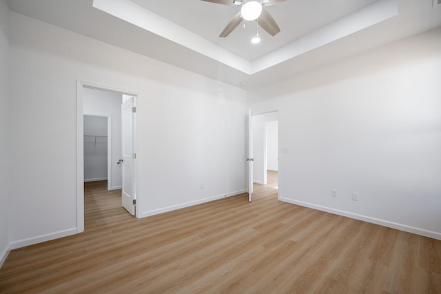 3016 Addison Rd, Chattanooga, TN 37406 - unfurnished room featuring light wood-style floors, a tray ceiling, a ceiling fan, and recessed lighting