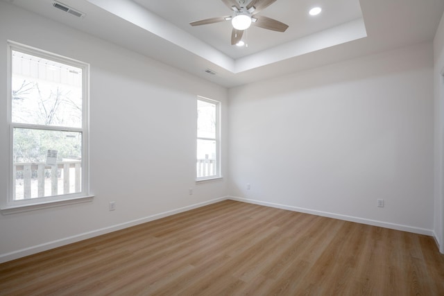 3016 Addison Rd, Chattanooga, TN 37406 - unfurnished room featuring light wood finished floors, a ceiling fan, a tray ceiling, and recessed lighting
