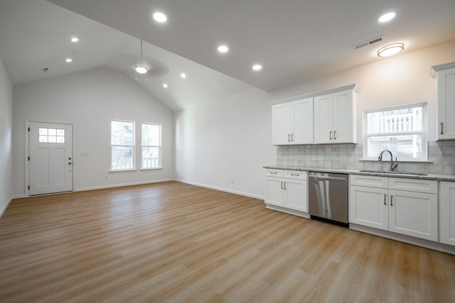 3016 Addison Rd, Chattanooga, TN 37406 - kitchen featuring stainless steel dishwasher, tasteful backsplash, light stone counters, a ceiling fan, and light wood finished floors
