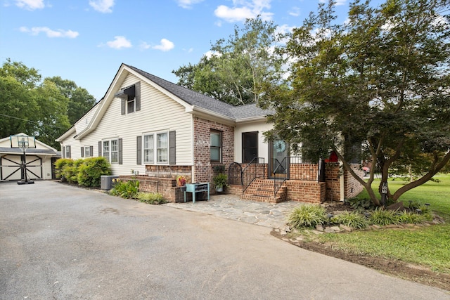 157 Park Ave, Trion, GA 30753 - view of front facade featuring brick siding, an outbuilding, and a garage