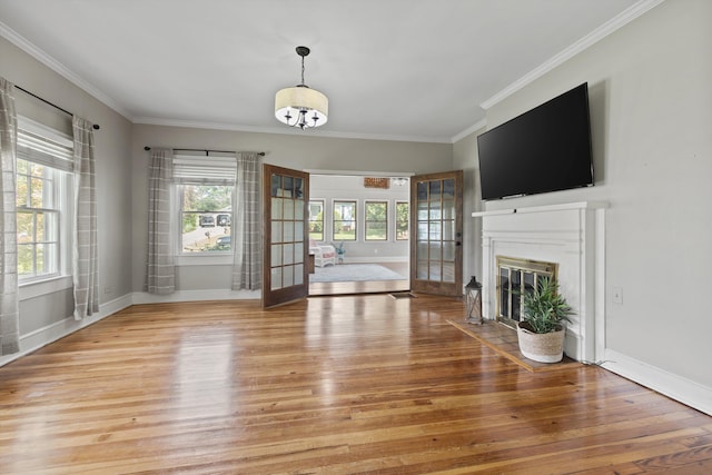 157 Park Ave, Trion, GA 30753 - unfurnished living room with a fireplace with flush hearth, crown molding, and light wood-style floors