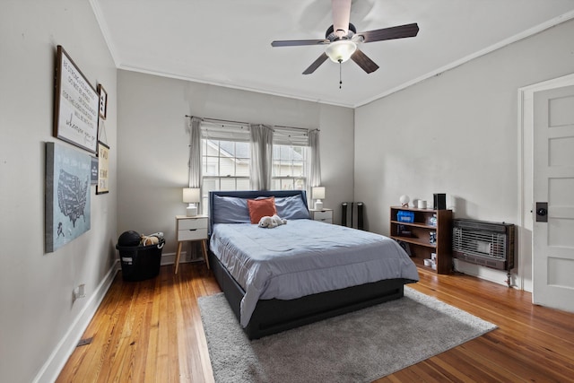 157 Park Ave, Trion, GA 30753 - bedroom with crown molding, hardwood / wood-style flooring, heating unit, ceiling fan, and radiator heating unit